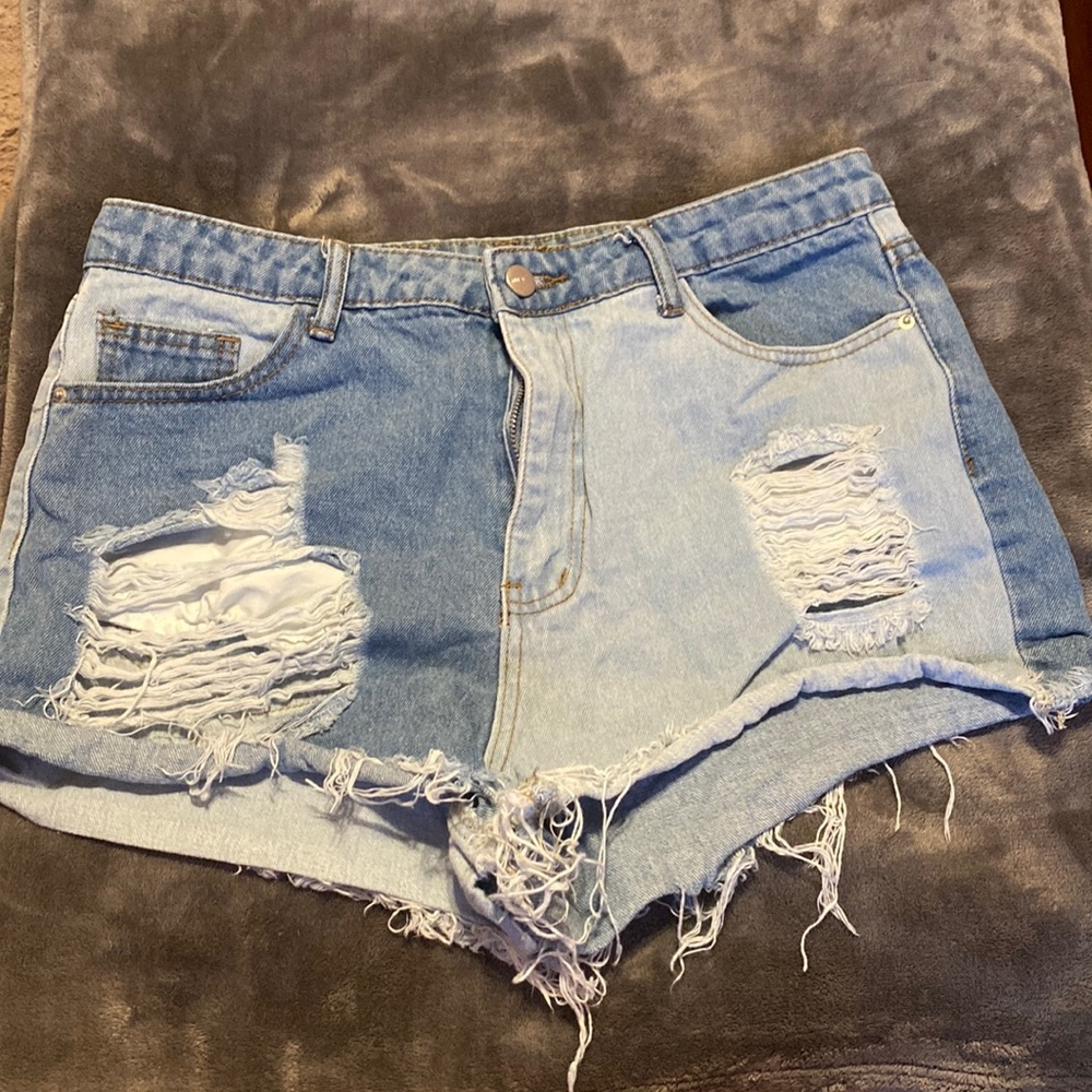Half light half dark denim shorts size large in womens.